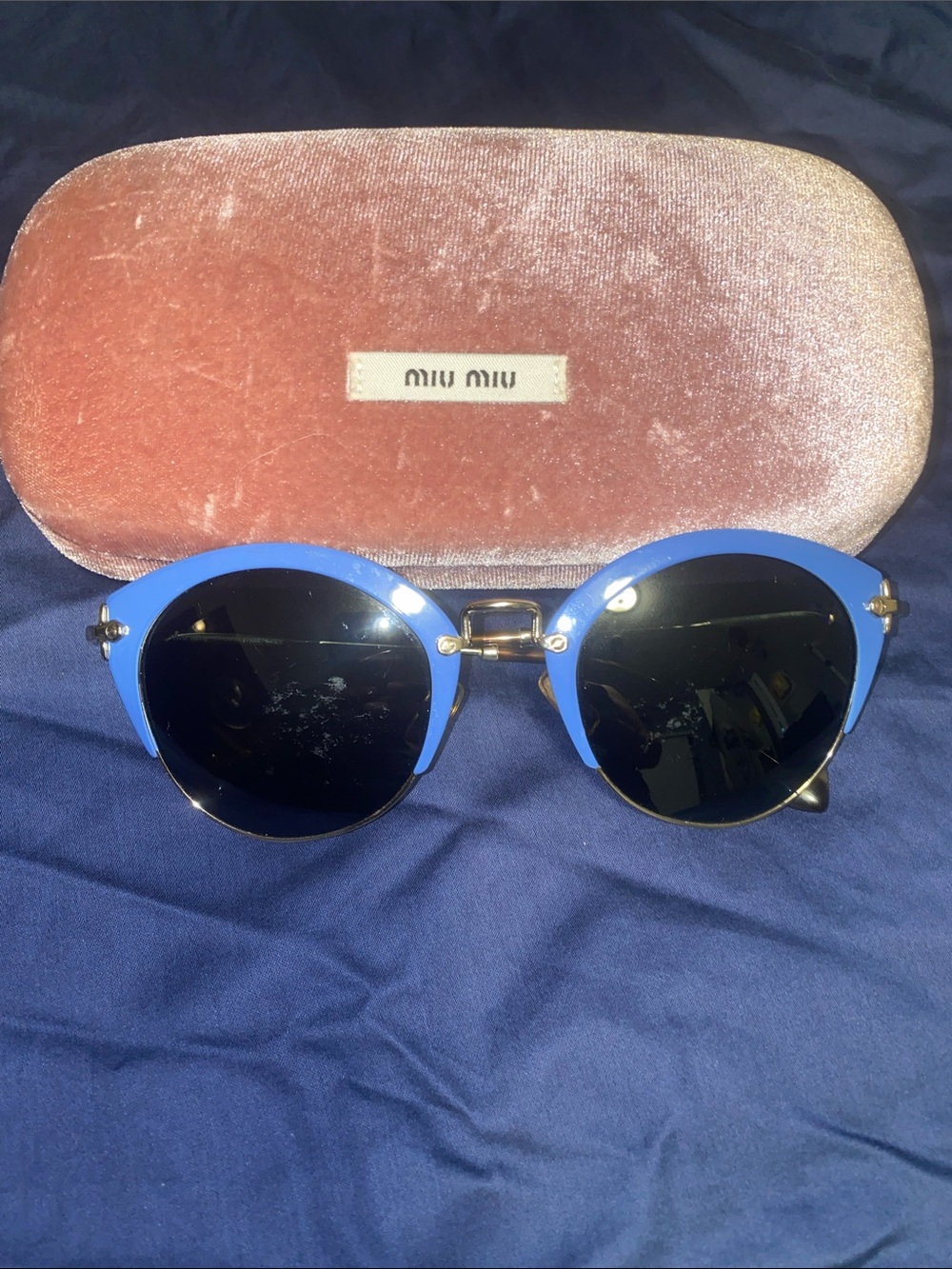 Authentic Miu Miu women’s Blue Round Metal-Trim Sunglasses